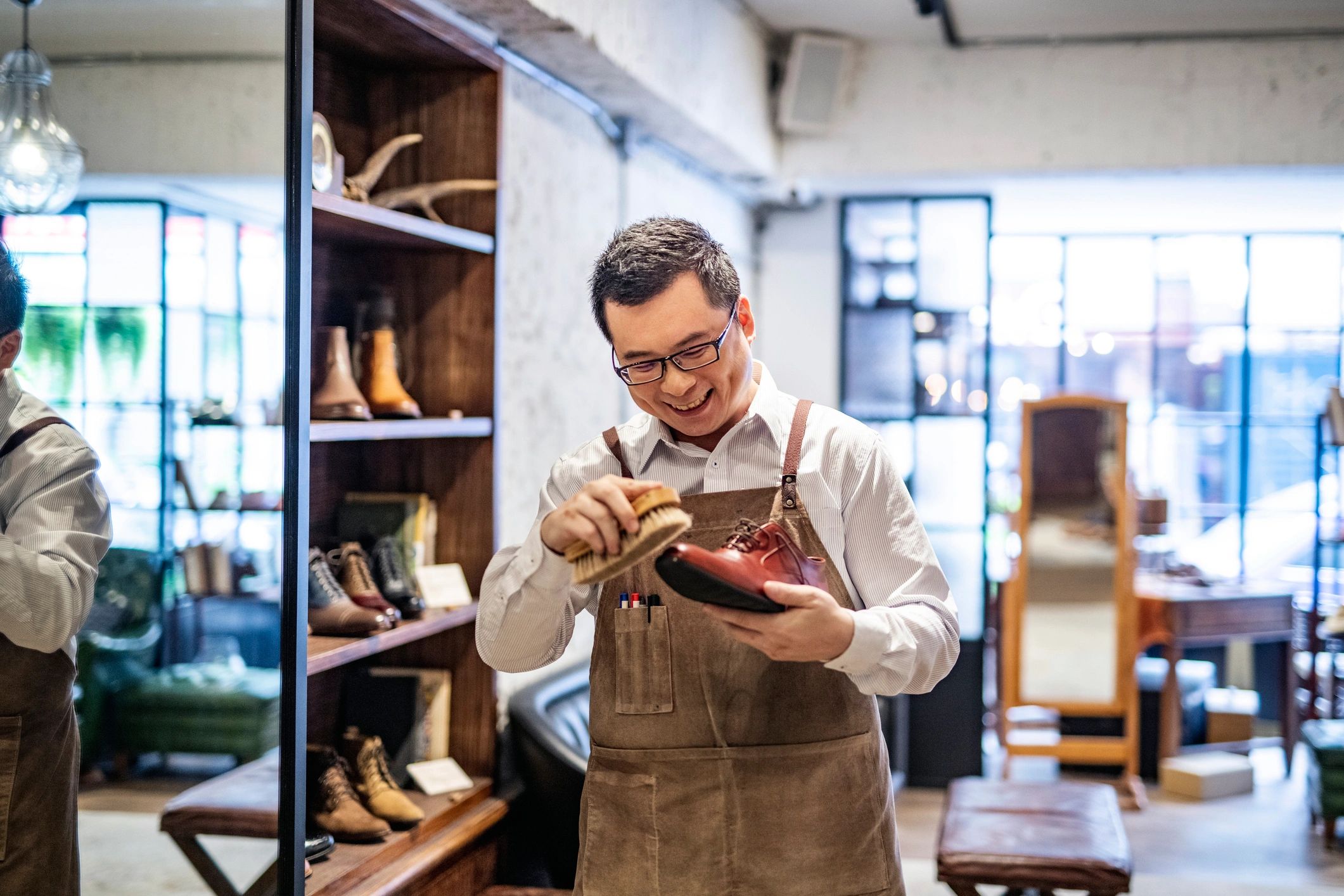 Shoe merchant working in a shoe store