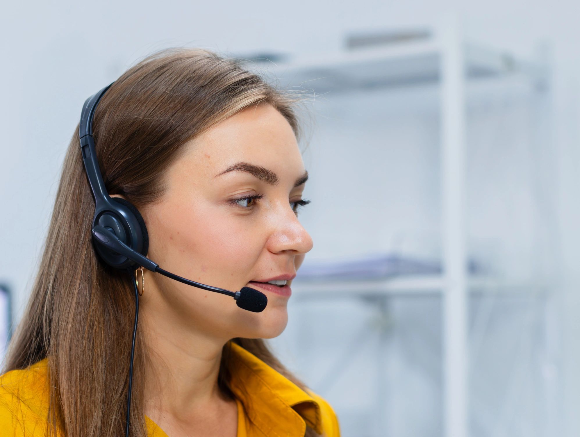 Support team member on headset representing operational support